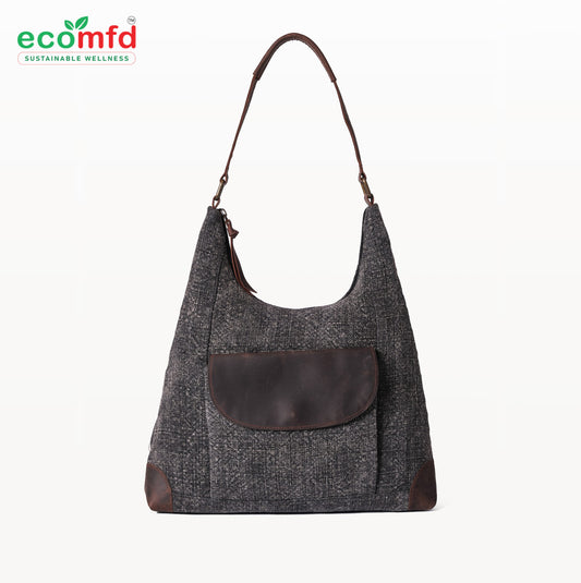 Gray shoulder bag with brown leather pocket on a white background, featuring the ecomfd brand.