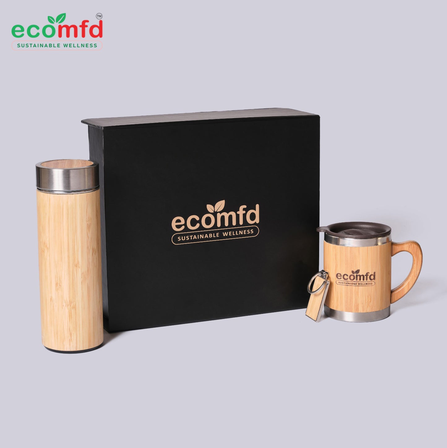 Two wooden mugs with metal lids and a black box featuring 'ecomfd' on a light gray background.